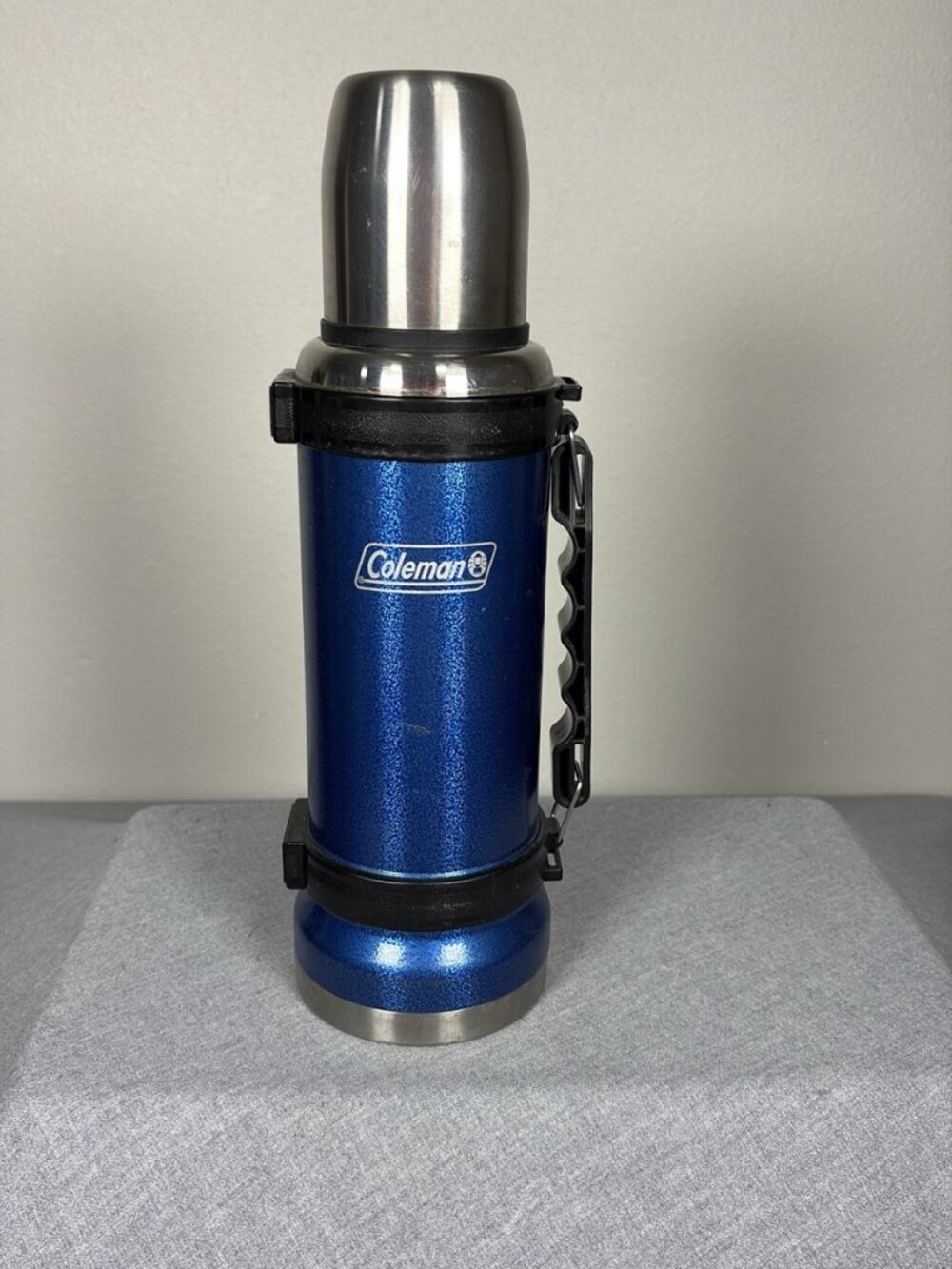 Coleman Stainless Steel Vacuum Insulated 1L Thermos Bottle with Blue Handle